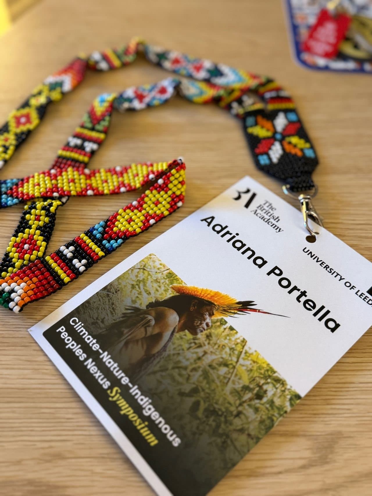Name badge with a beaded lanyard